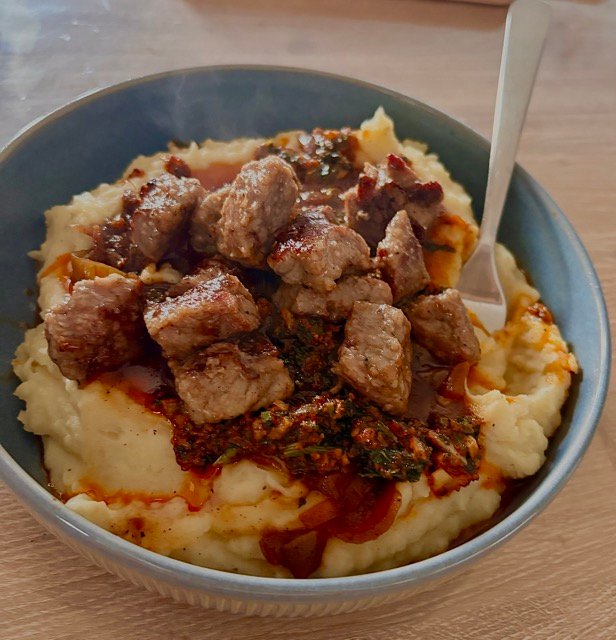 Mashed Potatoes with Steak Bites and Garlic Butter Sauce